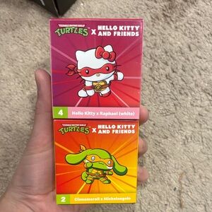 NWT hello kitty and ninja turtles figurine set of two